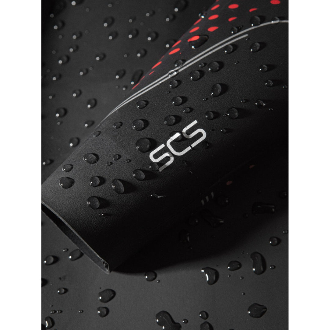 A black Orca Athlex Float V2 Triathlon Swimming Mens Wetsuit with red detailing on the sleeves. View of SCS logo on the cuff of the sleeve